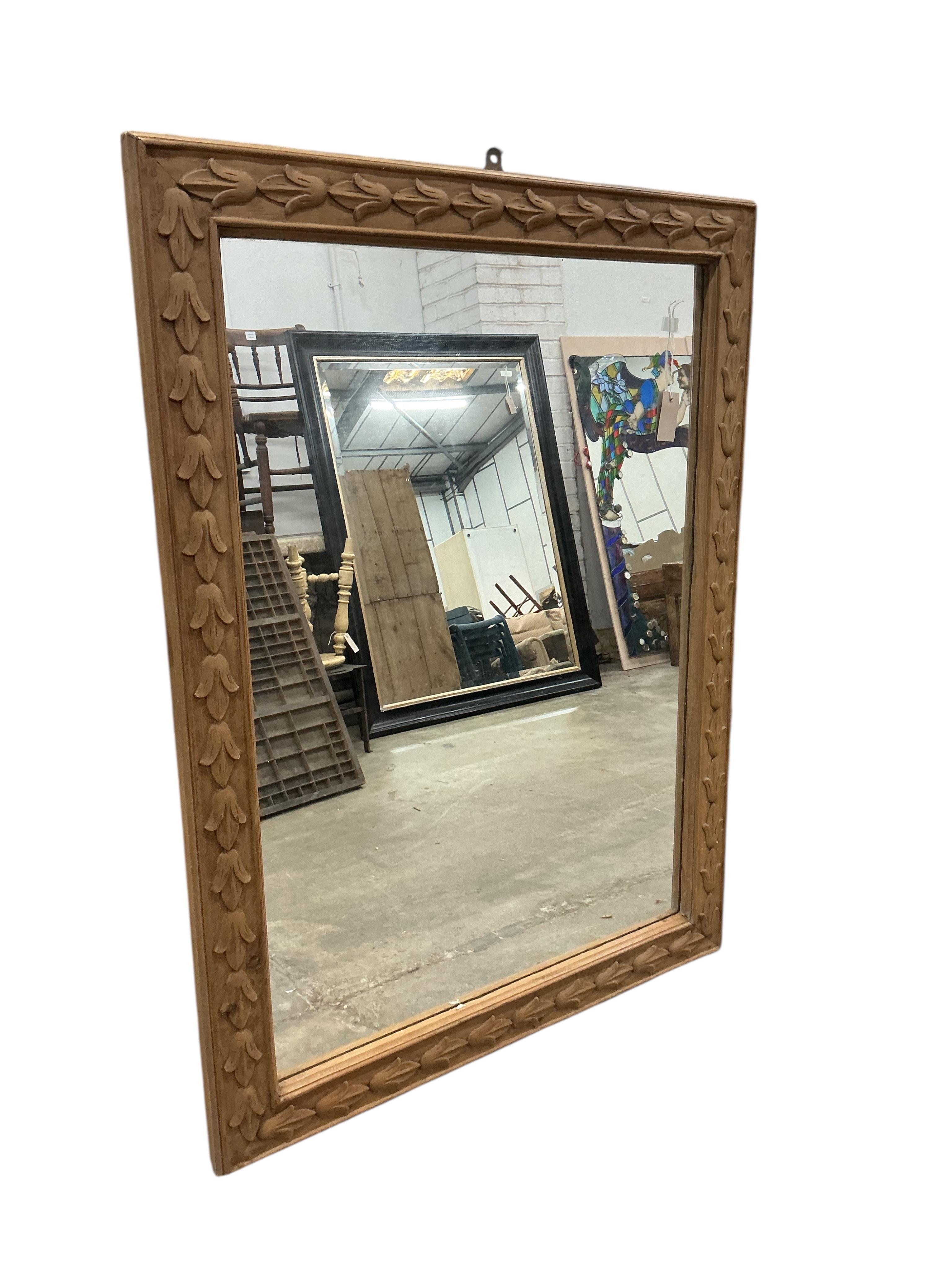 A rectangular carved pine overmantel mirror, width 122cm, height 92cm